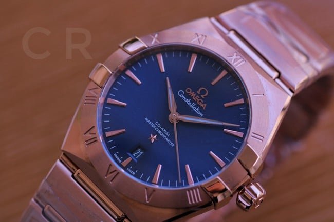 top-tier replica watch Omega fifth generation constellation series black dial gold steel bracelet men's watch front view